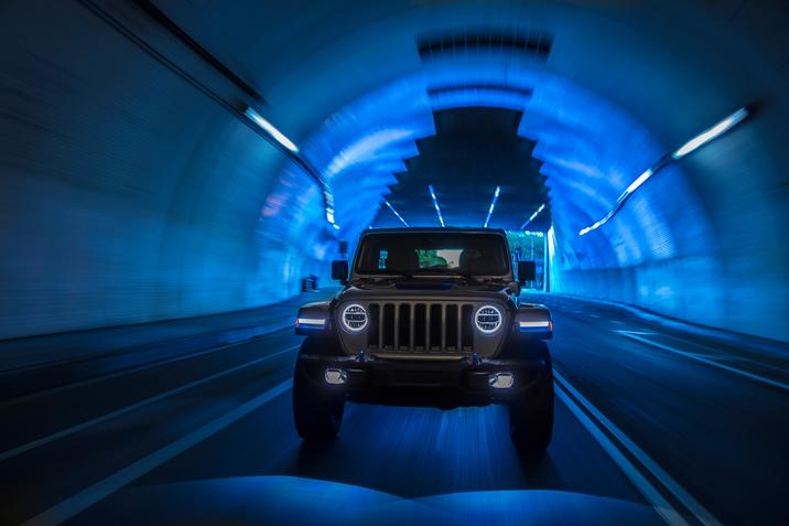 Front view of Jeep Wrangler 4xe 2021 in a blue tunnel