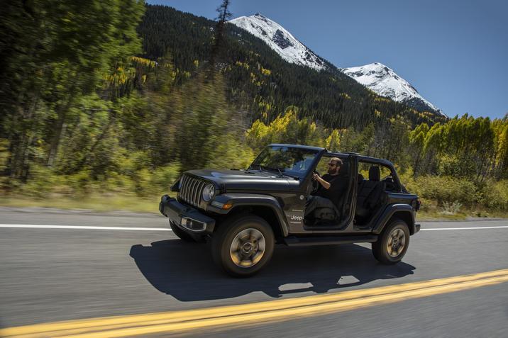 Side view of the 2020 Jeep Wrangler Sahara on the road